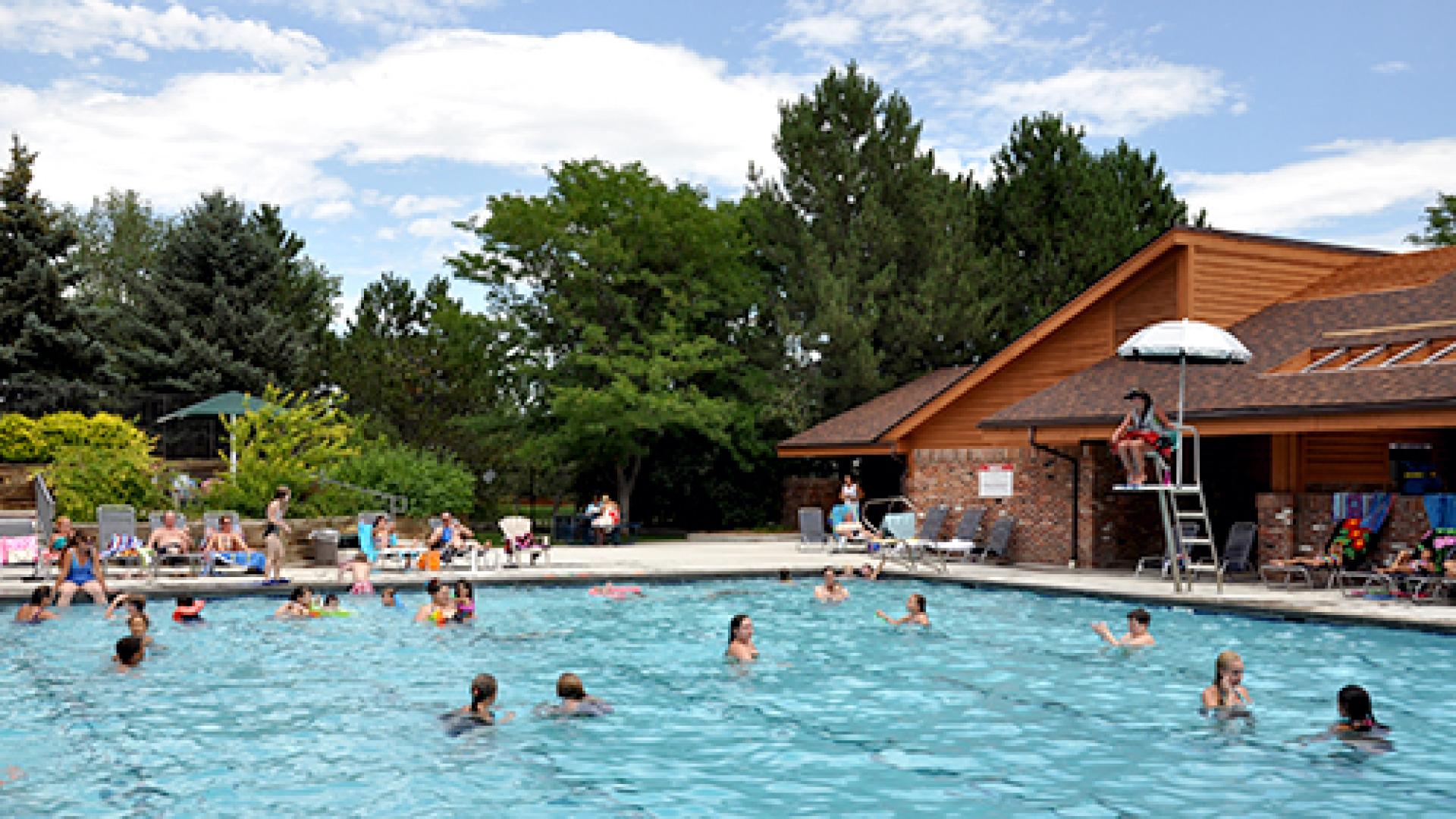 Adults and children in the Park Village Pool.