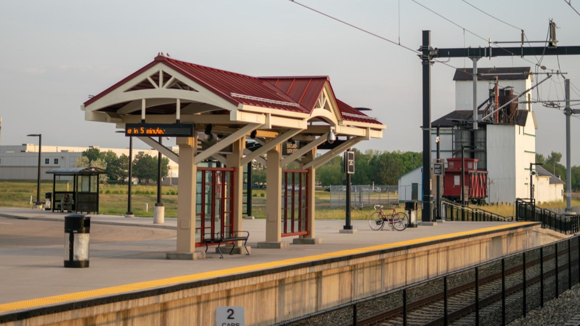Photograph of eastlake at 124th station from the train platform, featuring the eastlake grain elevator in the background.