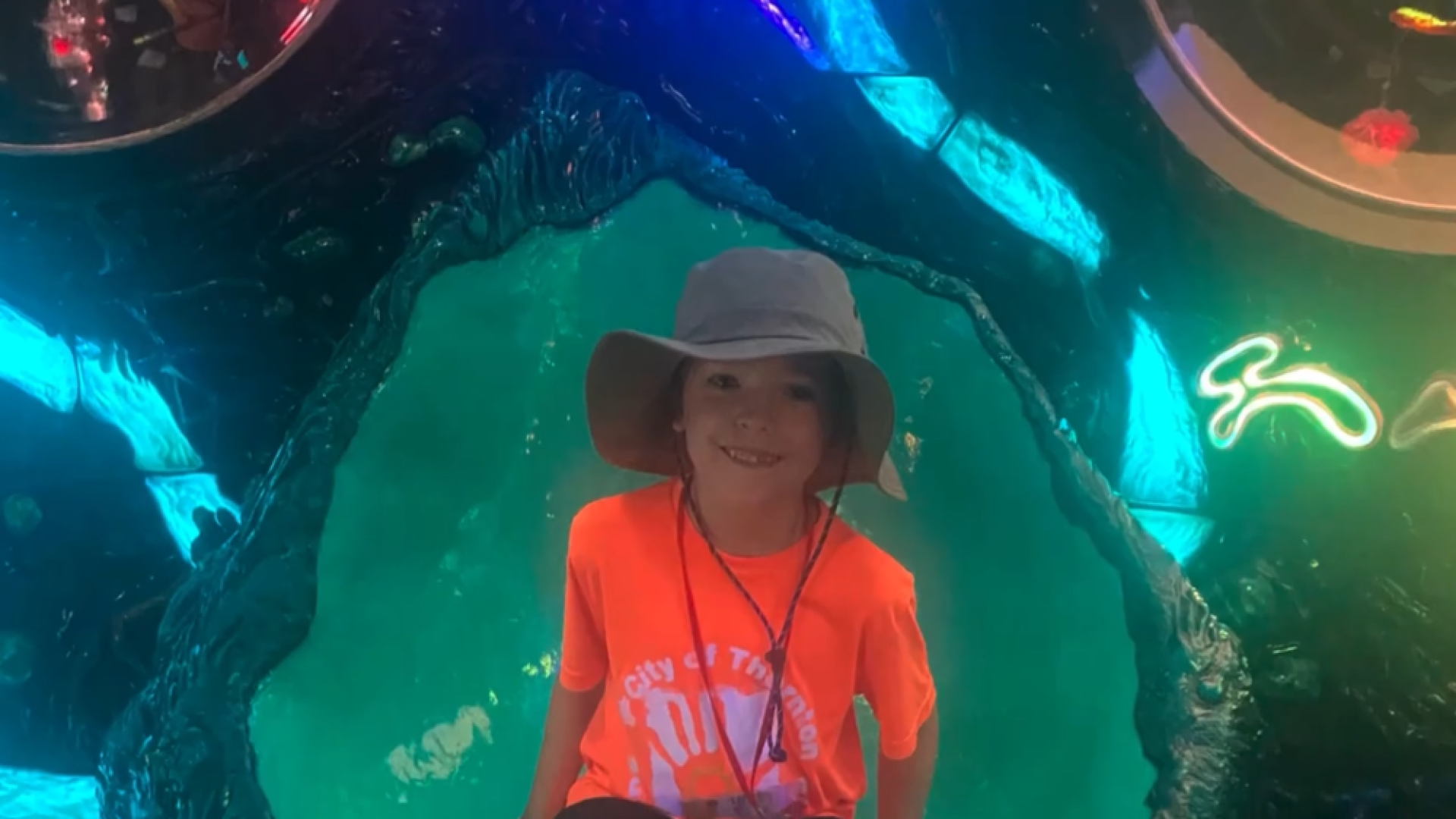 Young boy in orange participating in Thornton Summer Camp